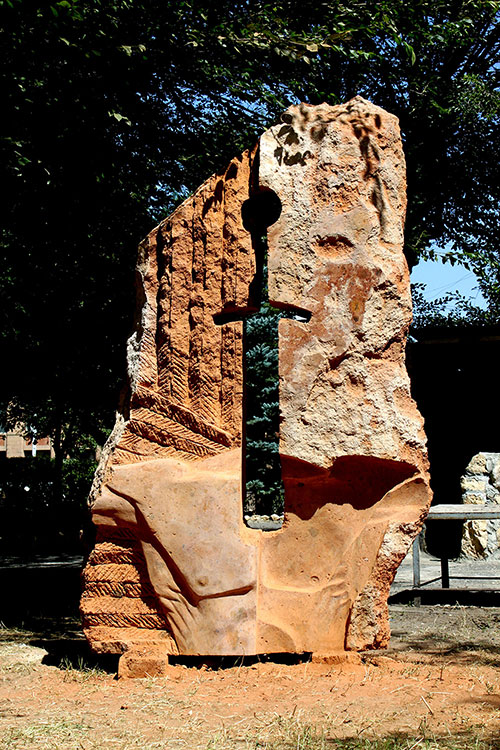 The sculptor Artem Medvedev. Contemporary sculpture. Apple of discord. Gyumri, Armenia. Front view. 2015, 202 x 120 x 50 cm, tufa granite